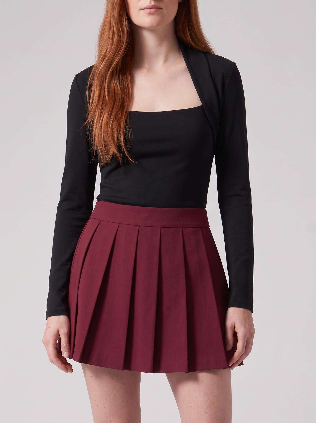 Burgundy Bellinna Tailored Pleated Mini Skirt — styled model view